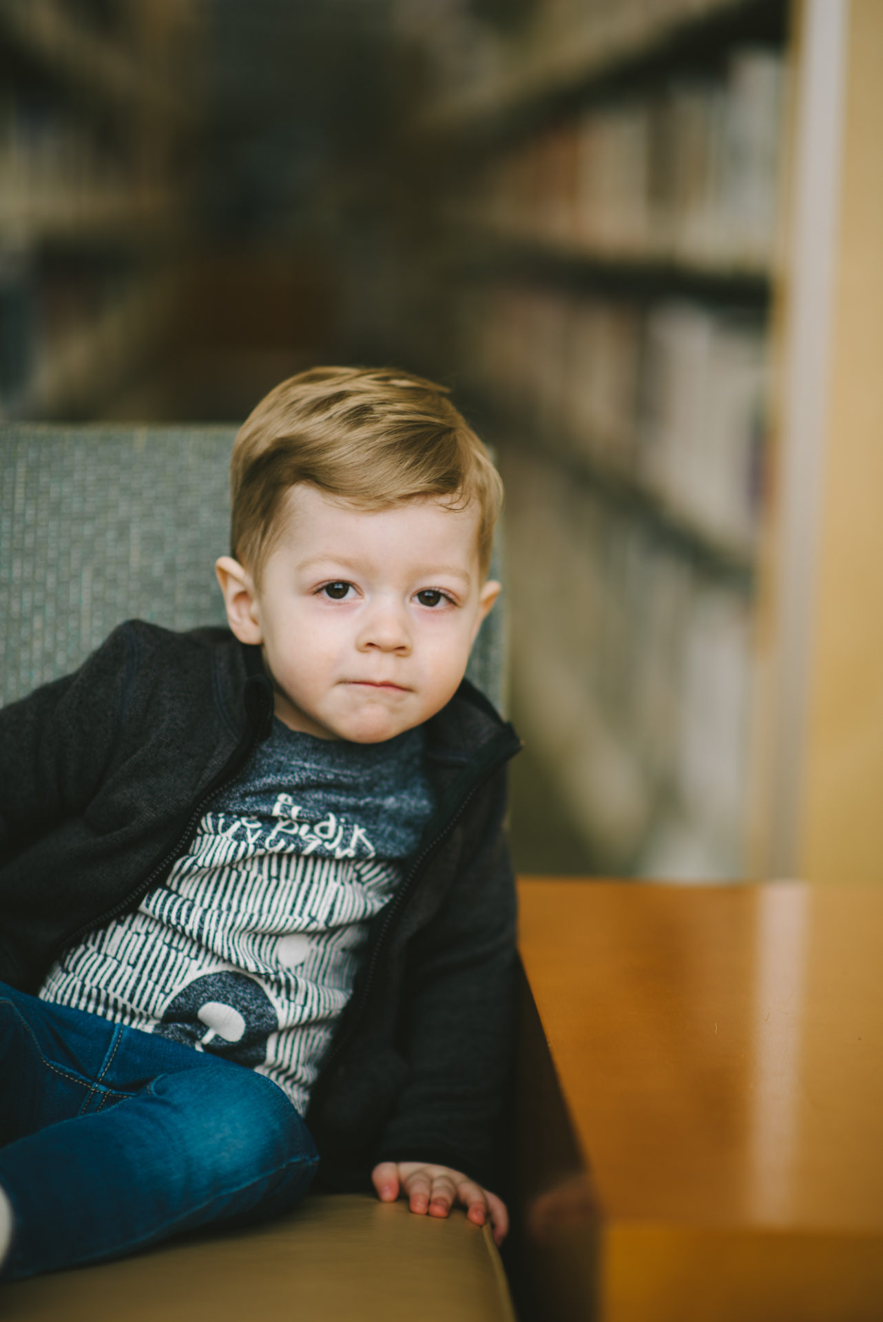 He's two! Reading books at the library.