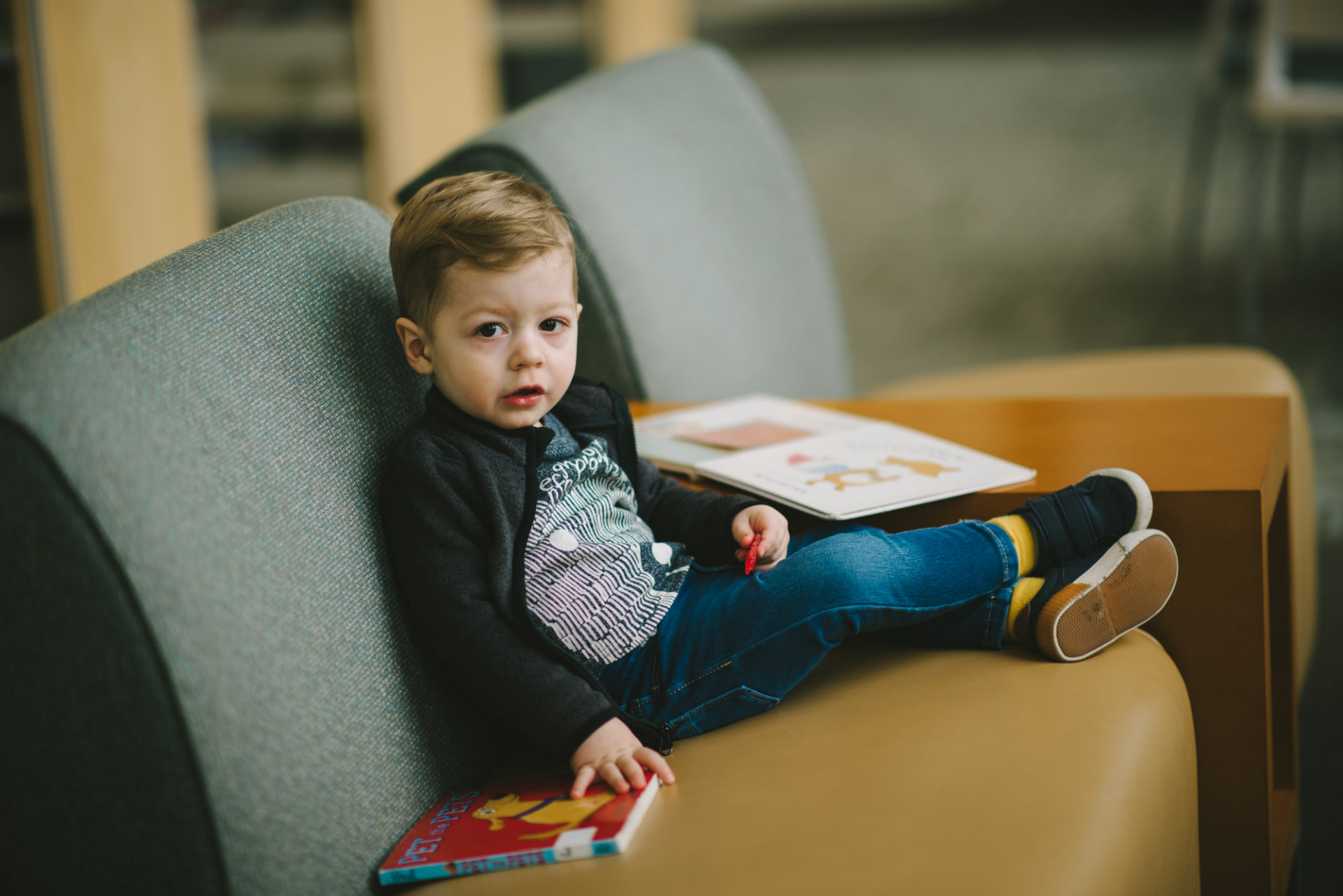 He's two! Reading books at the library.