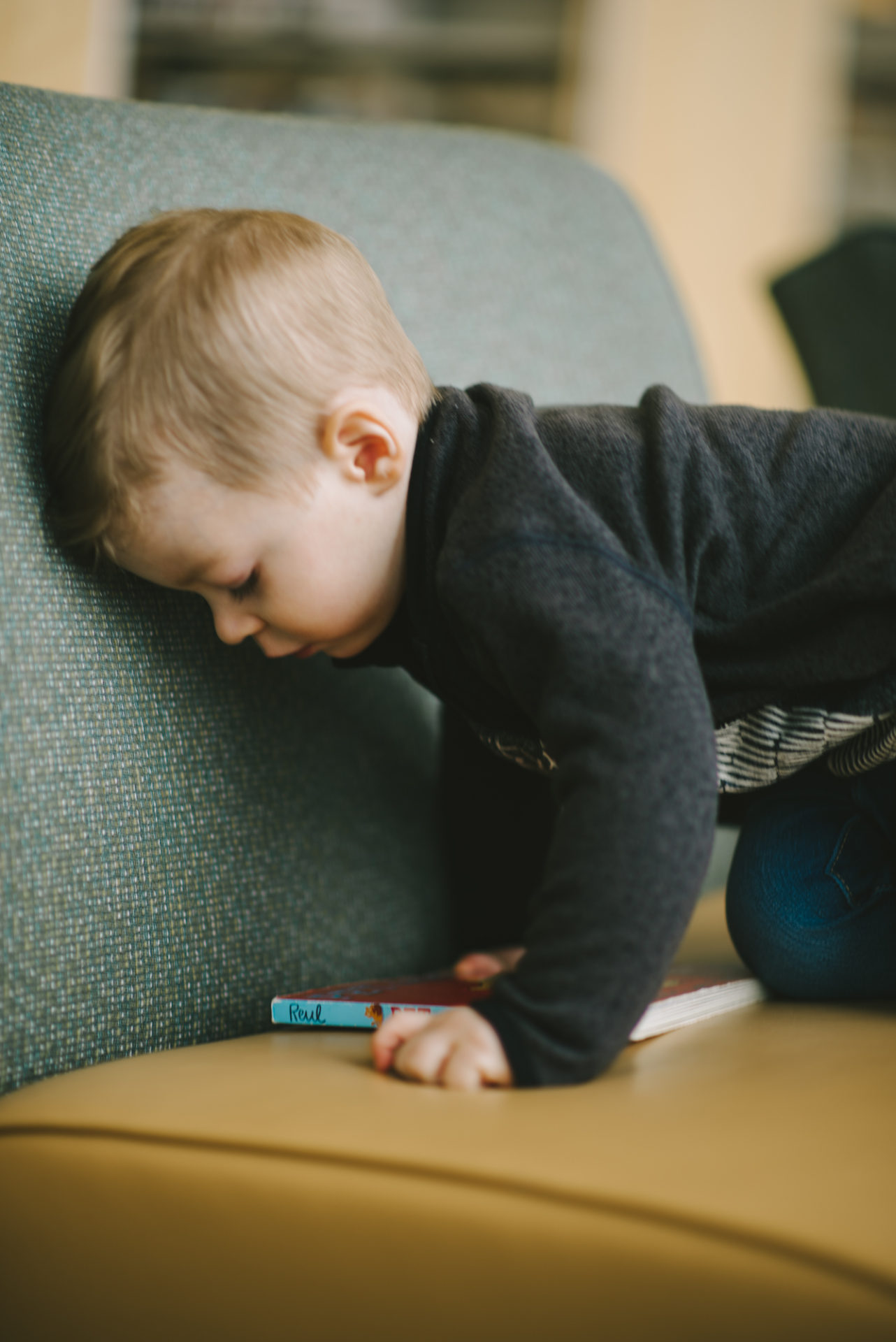 He's two! Reading books at the library.