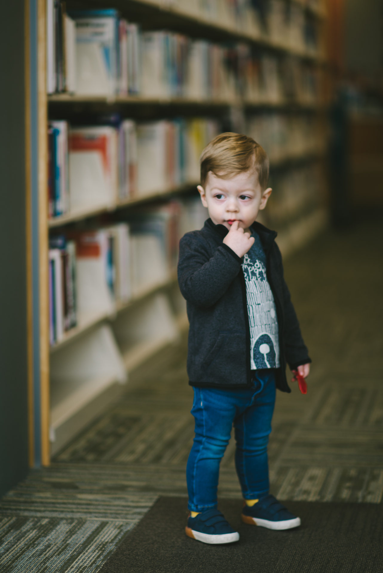 He's two! Reading books at the library.