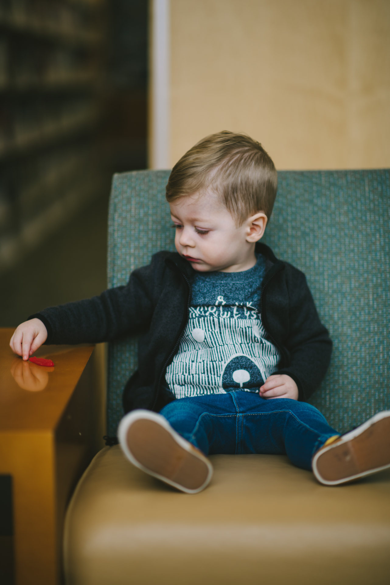 He's two! Reading books at the library.