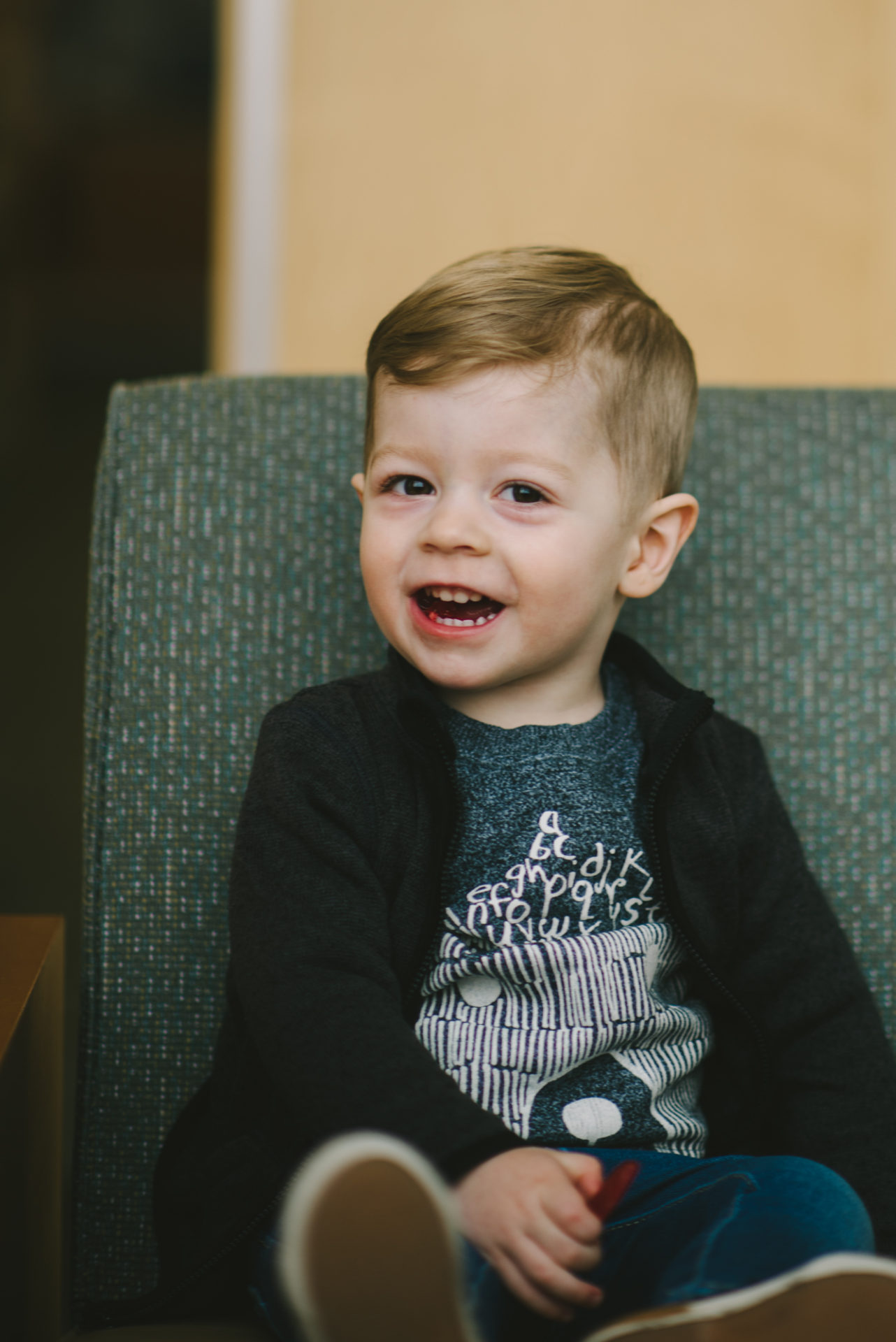 He's two! Reading books at the library.