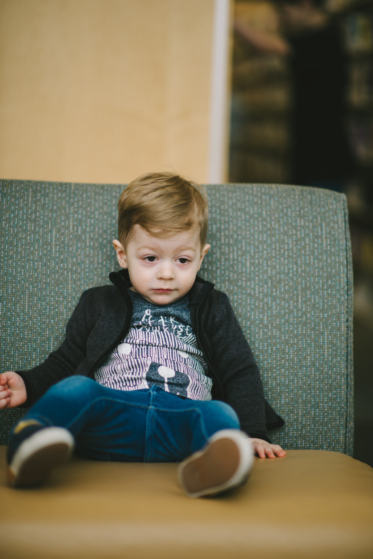 He's two! Reading books at the library.